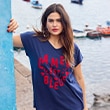 The model wears a blue shirt with a colorful print
