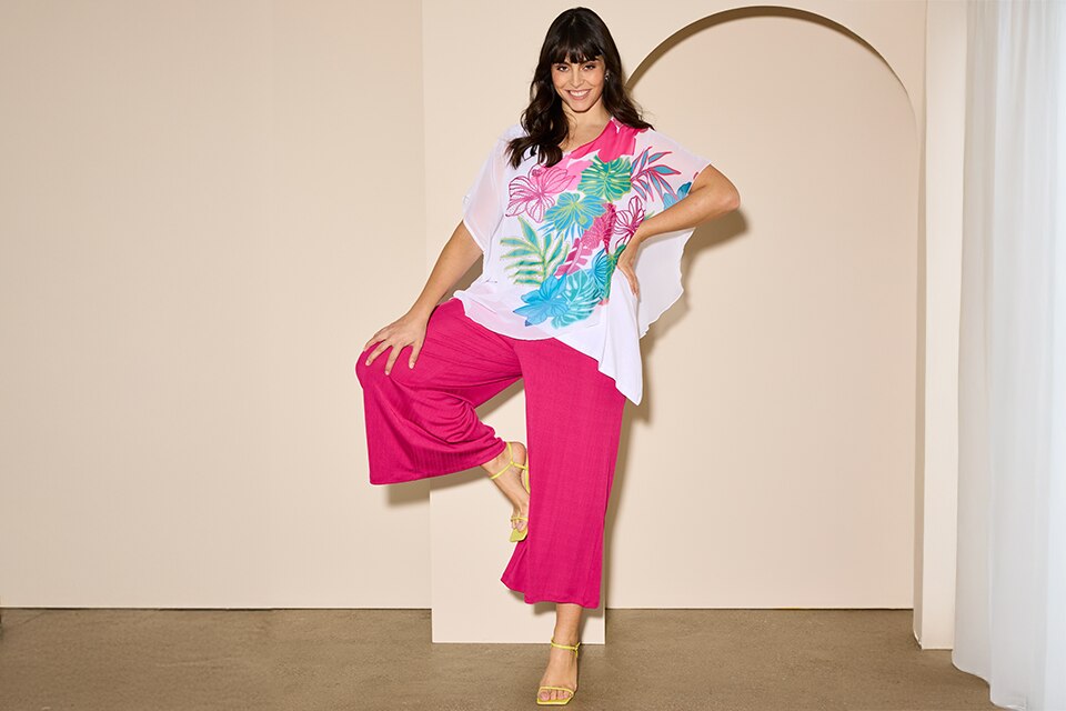 The model is wearing pink pants and a shirt