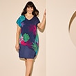 The model wears a colourful floral dress