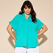 The model is wearing a turquoise-coloured blouse