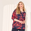 The model wears a colorfiul shirt