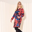 The model wears a colorful dress