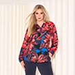 The model wears a colorful blouse