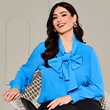 The model wears a blue blouse