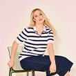 The model is wearing a blue and white striped sweater. 