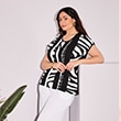 The model is wearing a black-and-white patterned shirt.