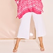 The model is wearing white trousers.