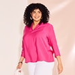 The model is wearing a pink blouse.