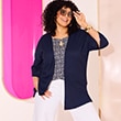 The model is wearing a navy blue cardigan.