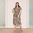 The model is wearing a brown dress.