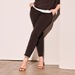 The model is wearing brown trousers.