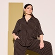 The model is wearing a brown striped blouse.
