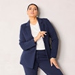 The model is wearing a blue blazer.