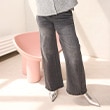 The model is wearing blue jeans.