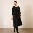The model is wearing a black dress.