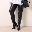The model is wearing black pants