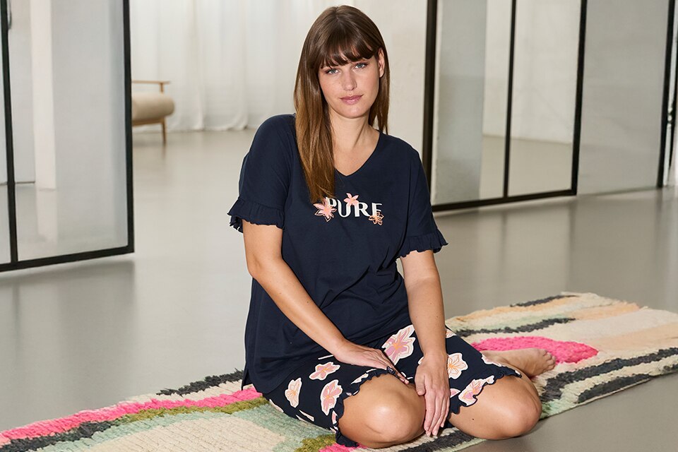 The model is wearing blue pyjamas
