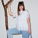 The model wears a green shirt with print 