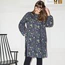 The model wears a long green cardigan
