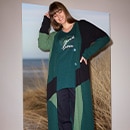 The model wears a green blouse 
