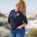 The model wears a blue mini dress