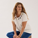 The model wears a blue dress