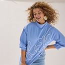 The model wears a white shirt