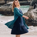 The model wears a blue blouse.