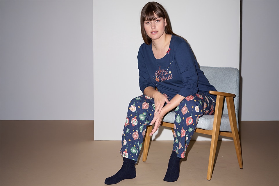 The model wears a blue nightgown

