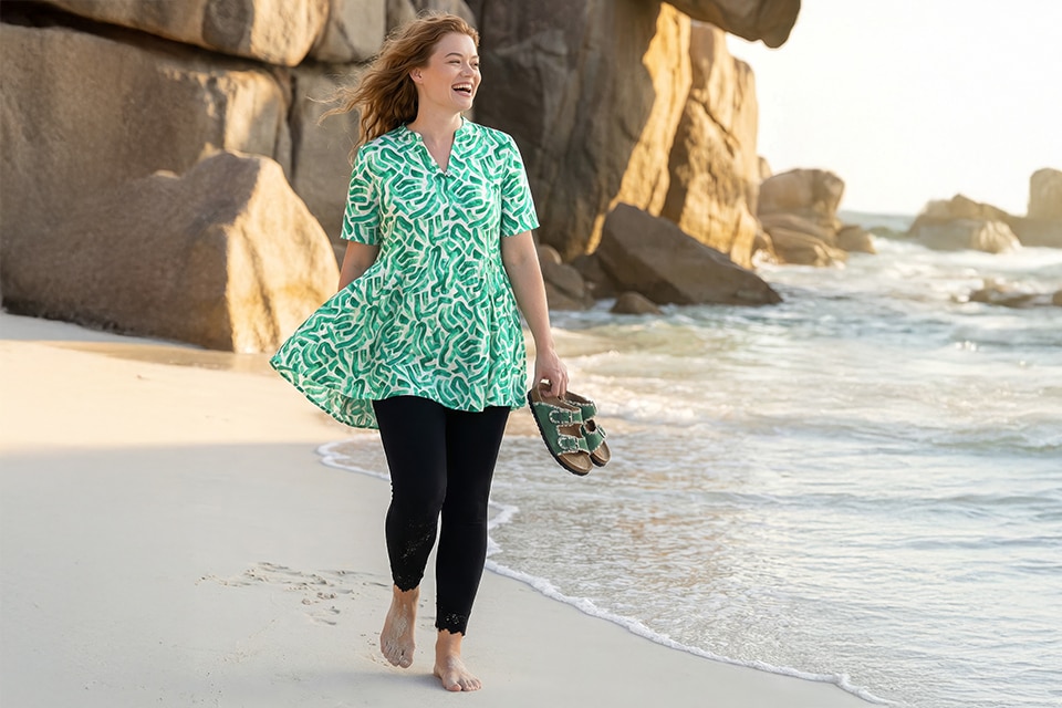 The model wears a green dress.
