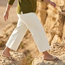 The model is wearing a grey shirt and jeans.

