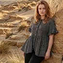 The model wears a dark green shirt.