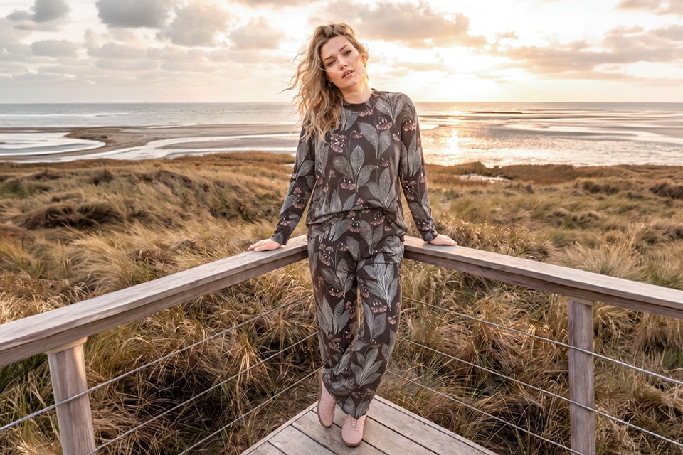 The model is wearing a shirt and a pants