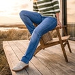 The model is wearing a shirt and a jeans.