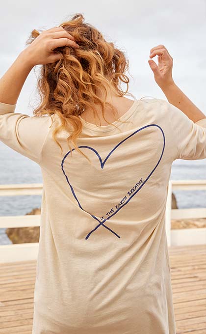 Model is turned round with heart T-shirt