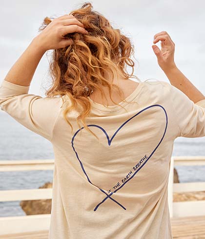 Model is turned round with heart T-shirt