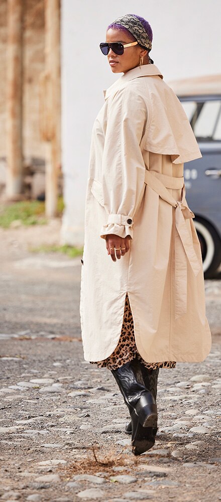 Model wearing a light trench coat