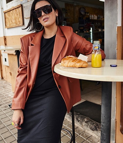 Model wearing a blazer and sunglasses