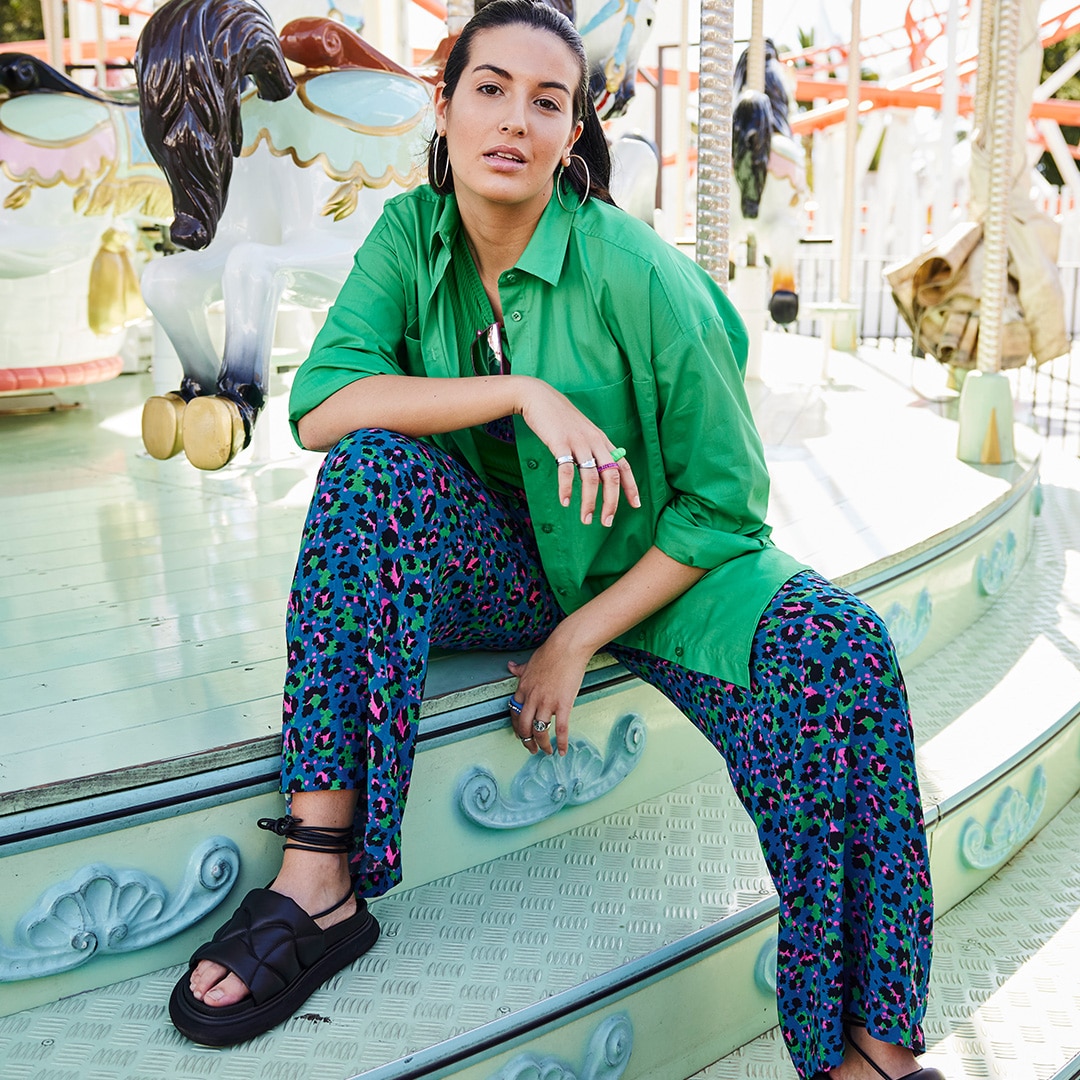 Model wearing a palazzo trousers with leo print