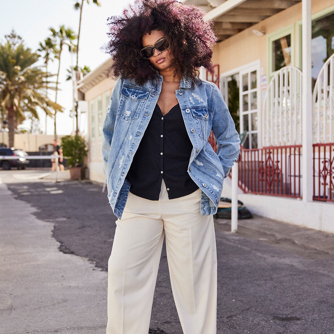 Woman wearing sunglasses and a jeans jacket