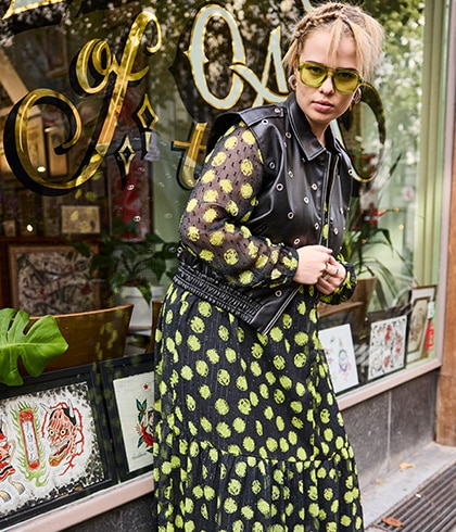 Model wears low-cut dress in leopard print