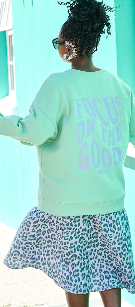 Modle wears a pink dress with the inscription