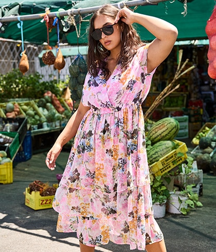 Model wears low-cut dress in leopard print