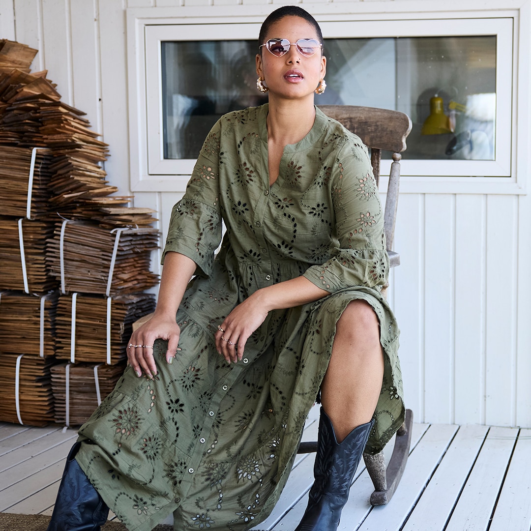 Woman wears oversize shirt with striped design