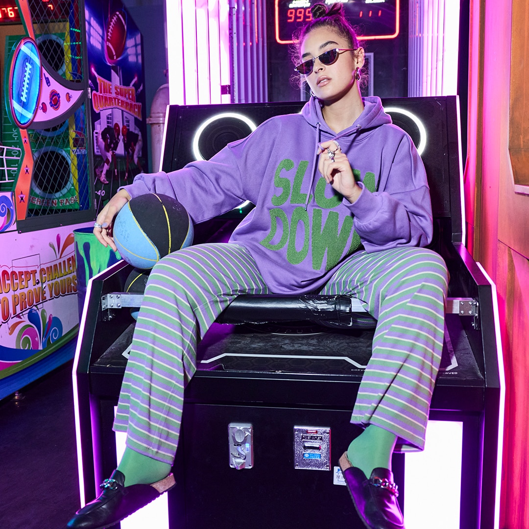 Model is wearing a blouse with a tribal-print