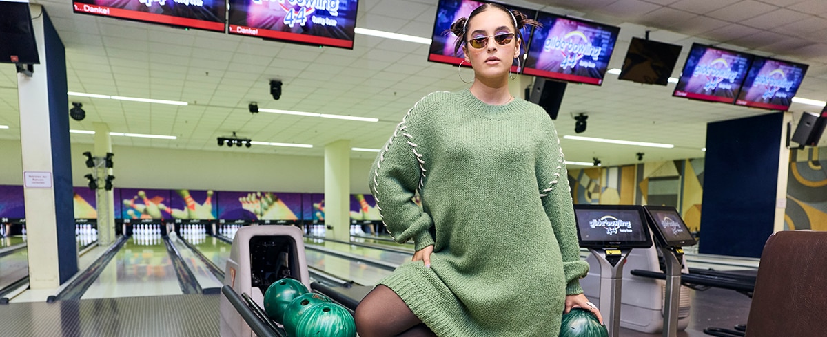 The model is wearing a blouse