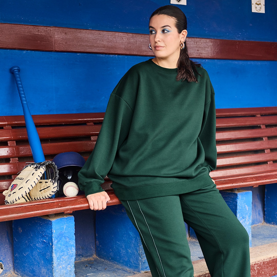 The model is wearing a wool dress with leopard print. 