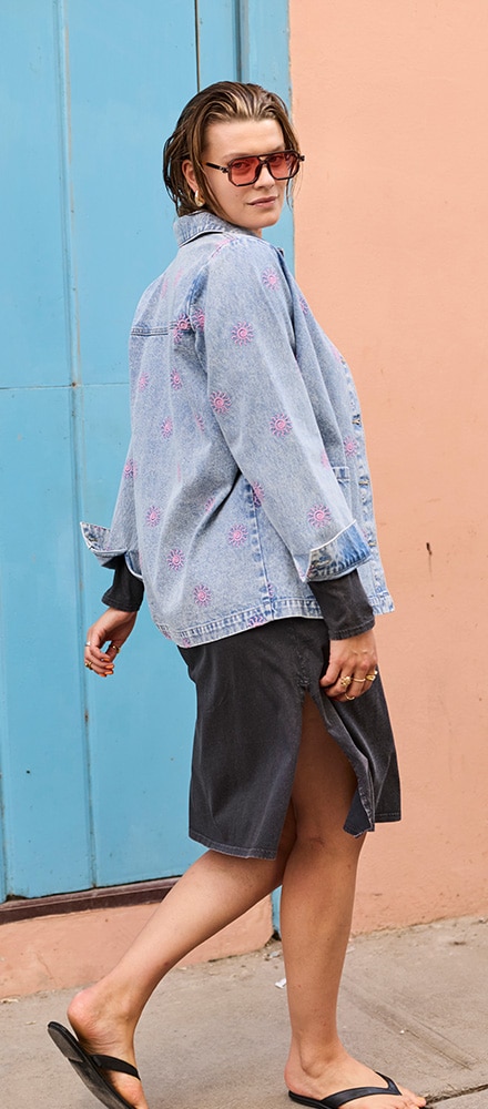 The model is wearing a denim jacket