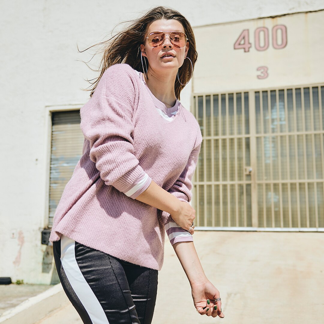 Model wearing a pink oversized pullover