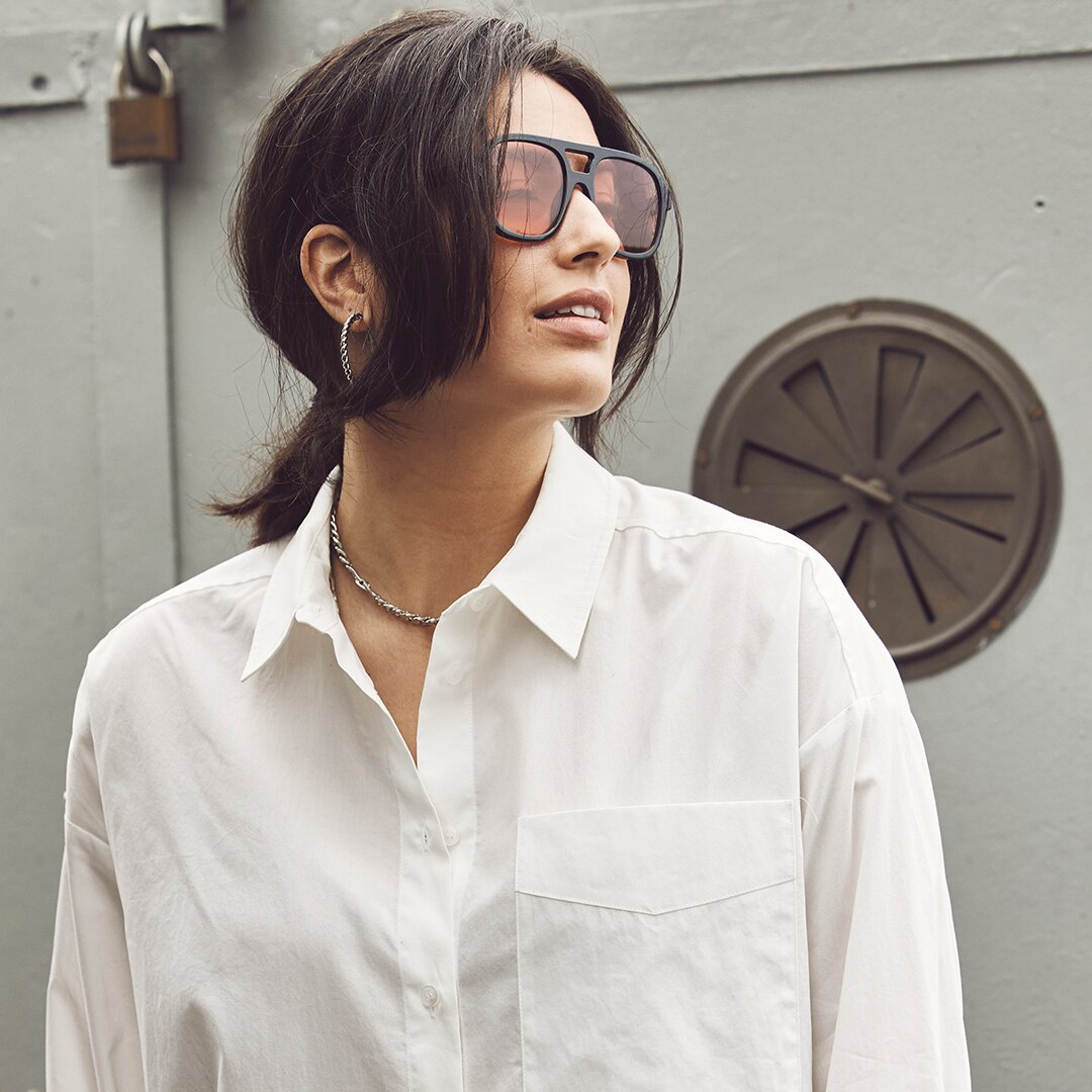 Woman with white blouse and sunglasses